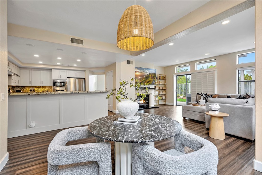 3171 Diamond View Street Corona, CA 92882 - Photo 19 of 49 a living room with furniture and a dining table