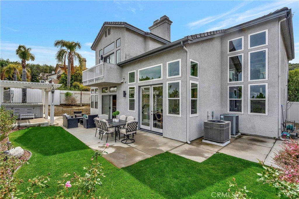 3171 Diamond View Street Corona, CA 92882 - Photo 20 of 49 a building outdoor space with patio furniture and potted plants