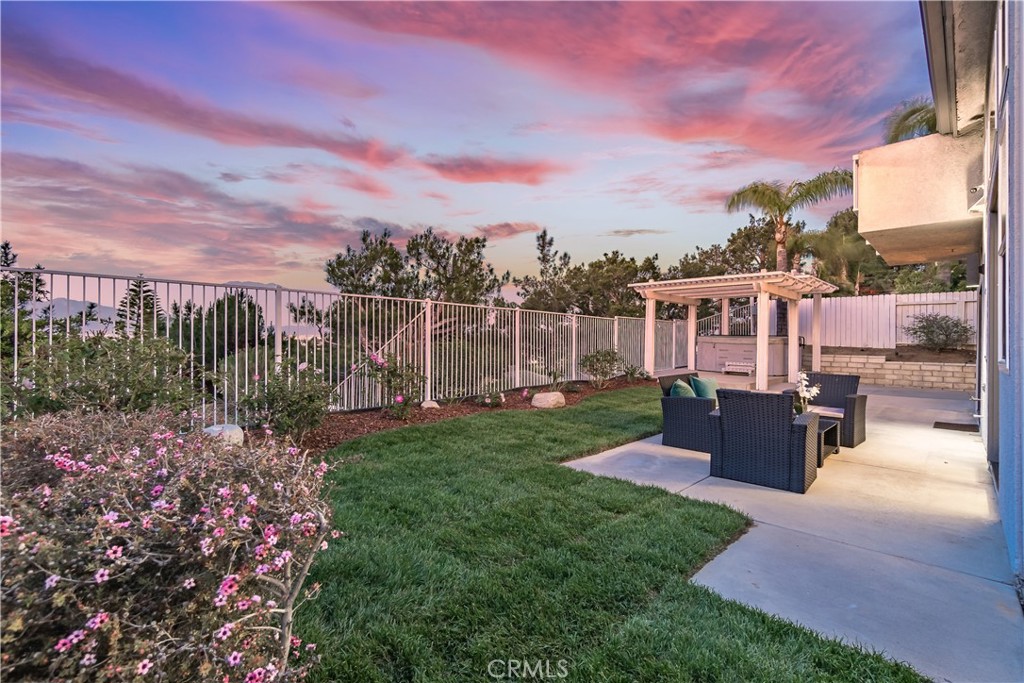3171 Diamond View Street Corona, CA 92882 - Photo 21 of 49 a view of a garden with a building in the background