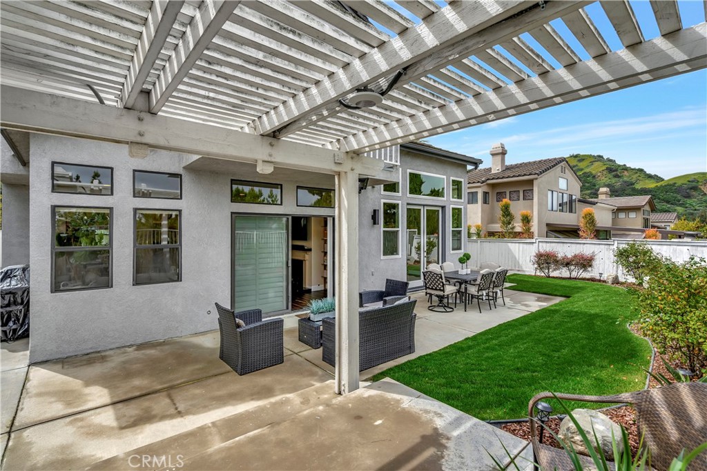 3171 Diamond View Street Corona, CA 92882 - Photo 23 of 49 a view of a porch with chairs and table