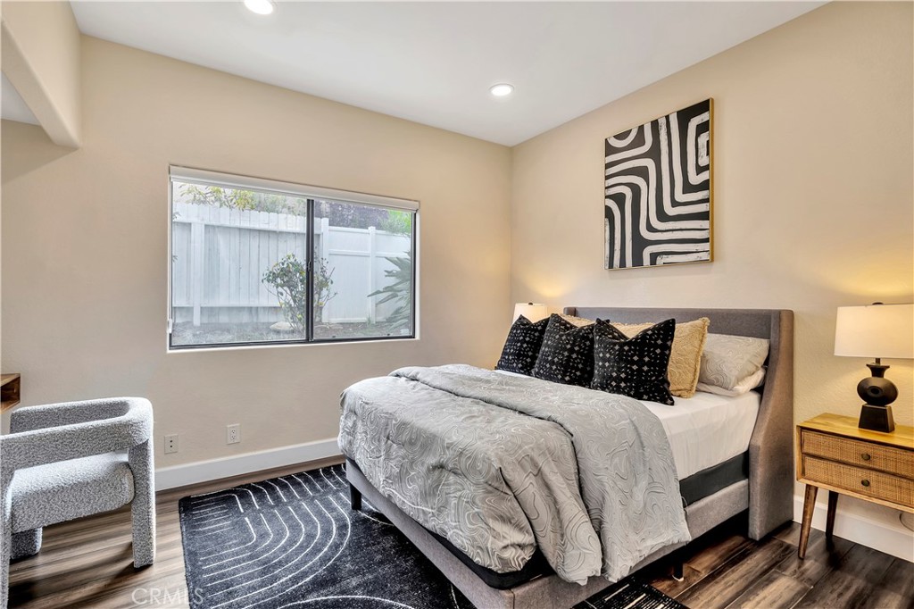 3171 Diamond View Street Corona, CA 92882 - Photo 28 of 49 a bedroom with a bed and a painting on the wall