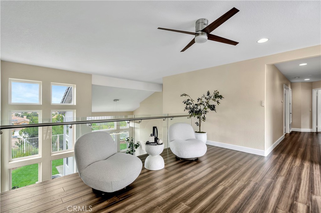 3171 Diamond View Street Corona, CA 92882 - Photo 33 of 49 a living room with furniture and a wooden floor