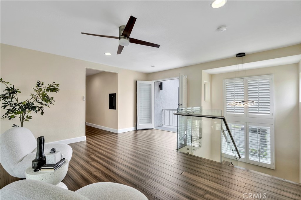 3171 Diamond View Street Corona, CA 92882 - Photo 34 of 49 a living room with furniture and a wooden floor