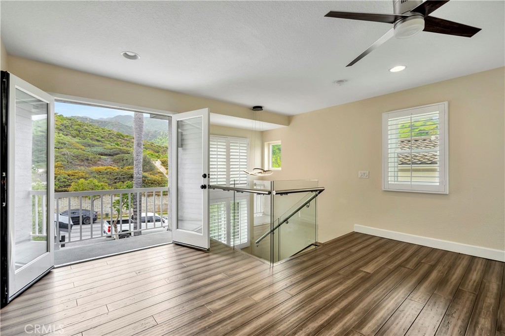 3171 Diamond View Street Corona, CA 92882 - Photo 35 of 49 a view of empty room with wooden floor and fan