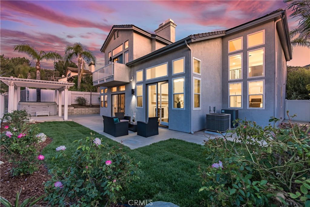 3171 Diamond View Street Corona, CA 92882 - Photo 48 of 49 a view of a house with backyard sitting area and garden