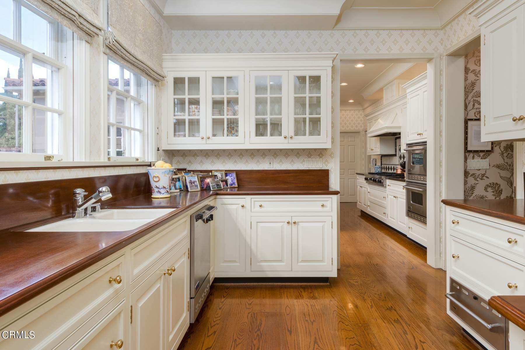 1585 Orlando Road Pasadena, CA 91106 - Photo 13 of 47 a kitchen with granite countertop a sink and cabinets