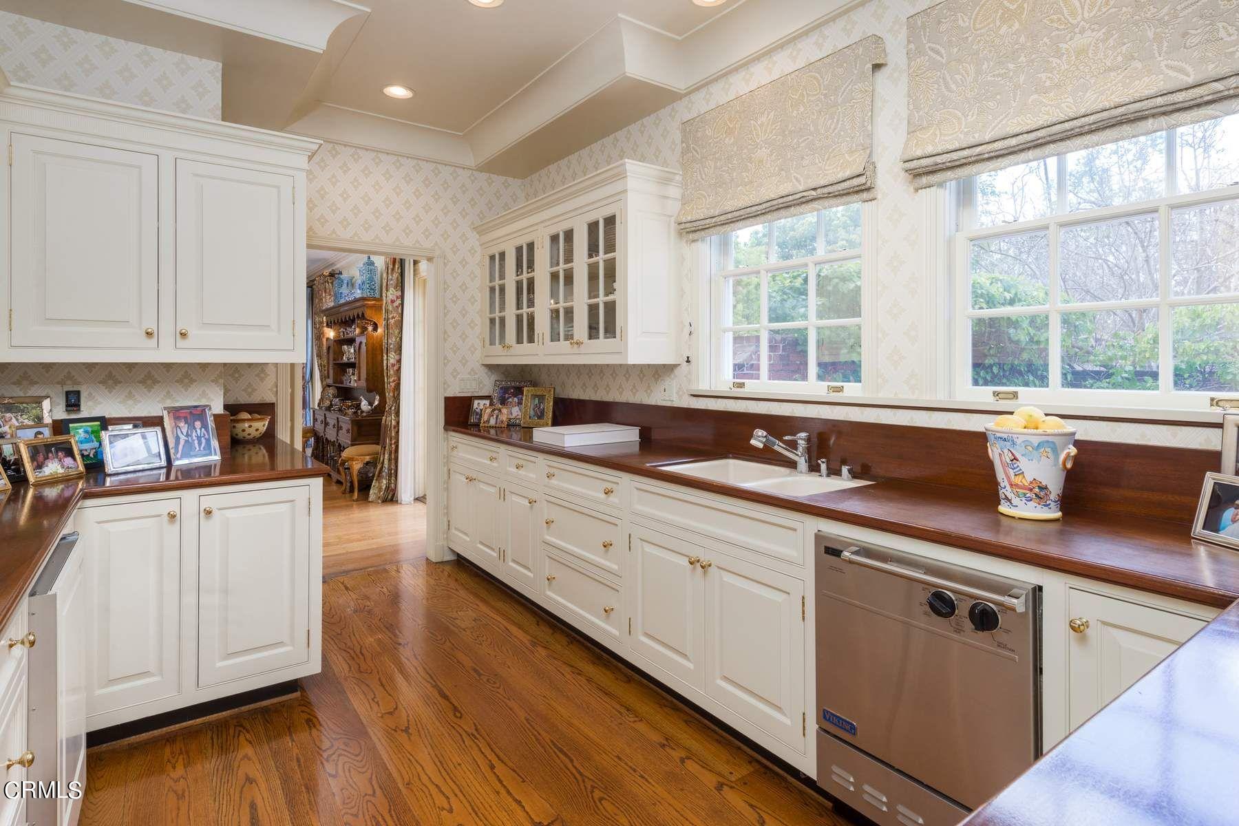 1585 Orlando Road Pasadena, CA 91106 - Photo 14 of 47 a kitchen with stainless steel appliances granite countertop a sink a stove and cabinets