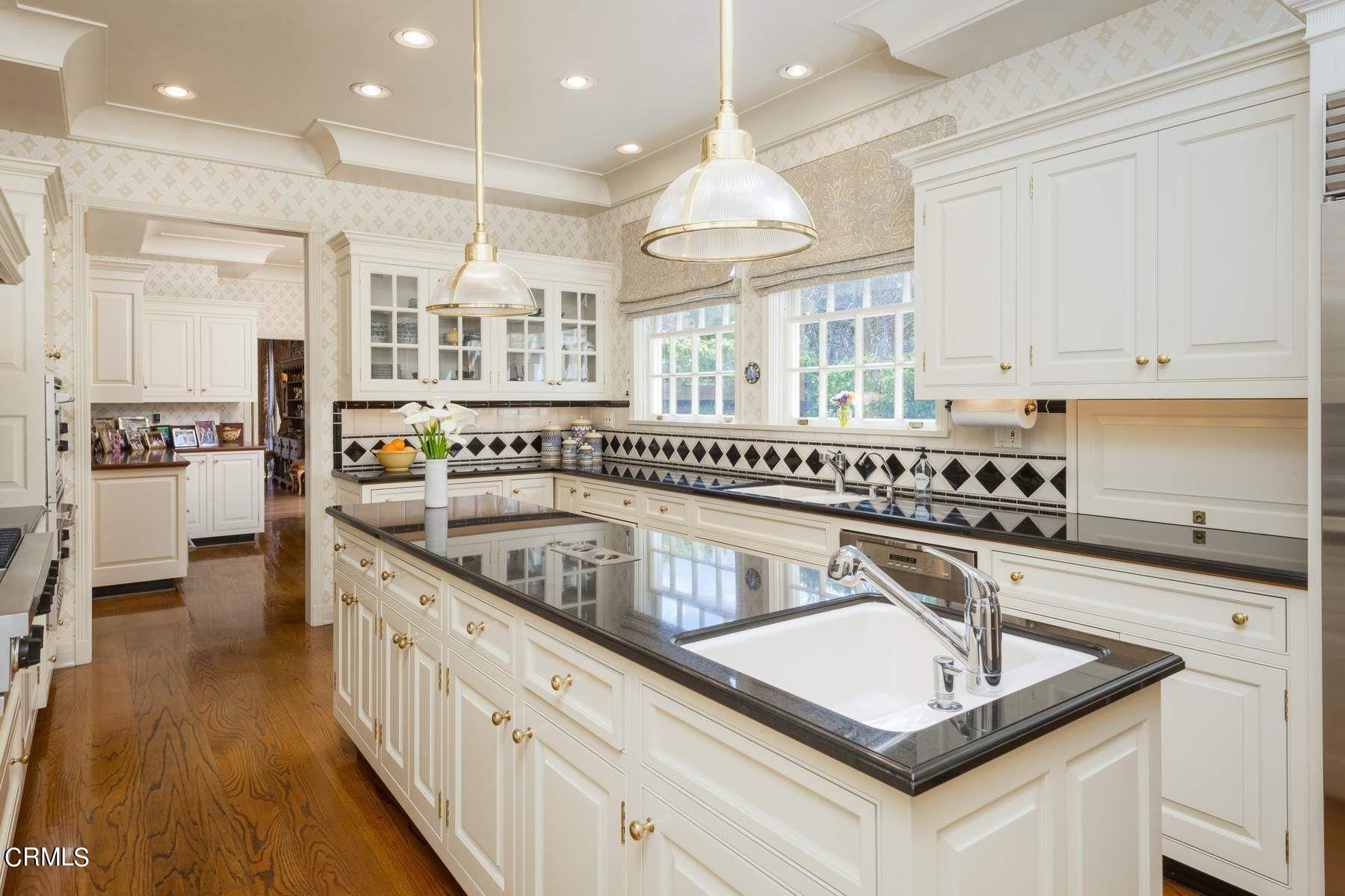 1585 Orlando Road Pasadena, CA 91106 - Photo 16 of 47 a kitchen with stainless steel appliances granite countertop a sink stove and cabinets