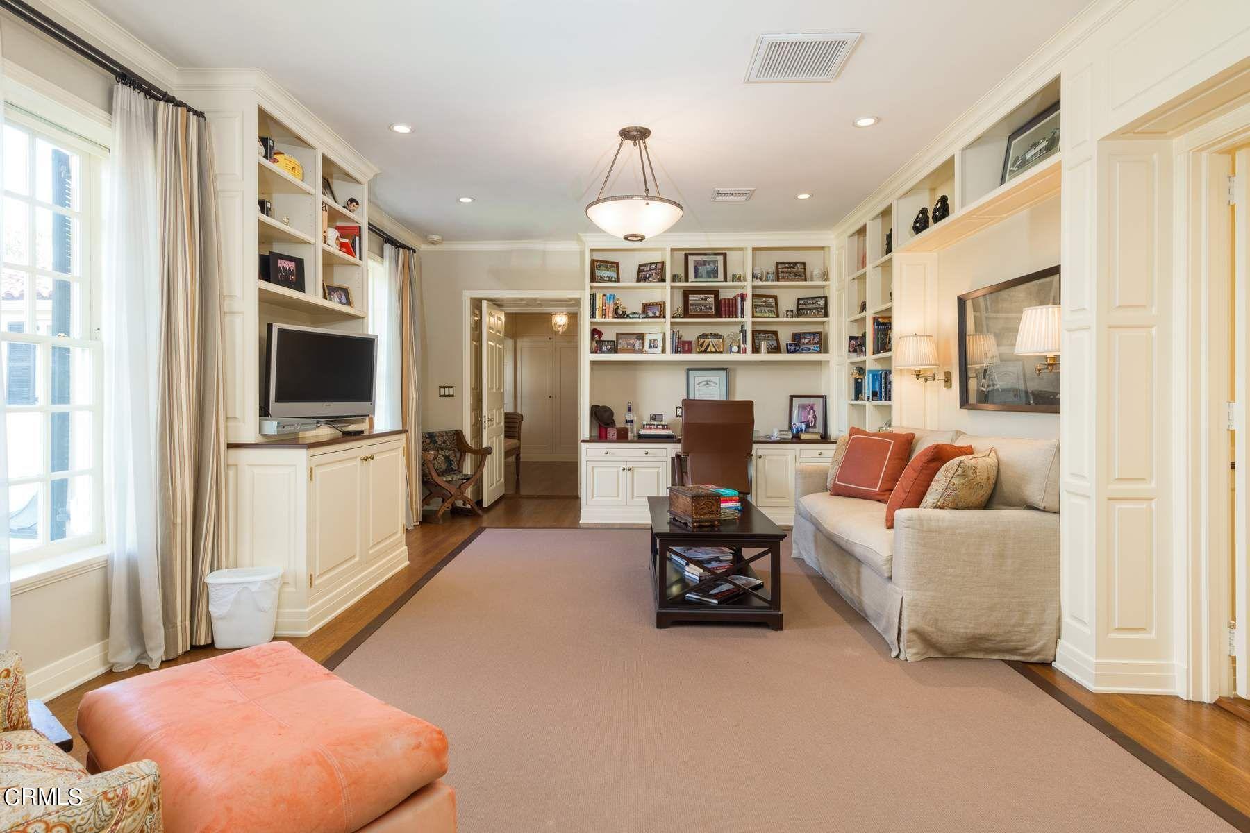1585 Orlando Road Pasadena, CA 91106 - Photo 29 of 47 a living room with furniture and a flat screen tv