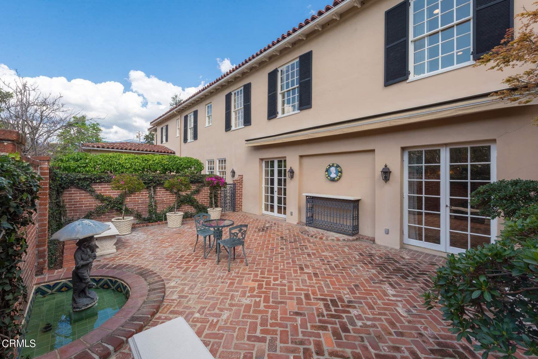1585 Orlando Road Pasadena, CA 91106 - Photo 35 of 47 a view of a patio with couches table and chairs and potted plants