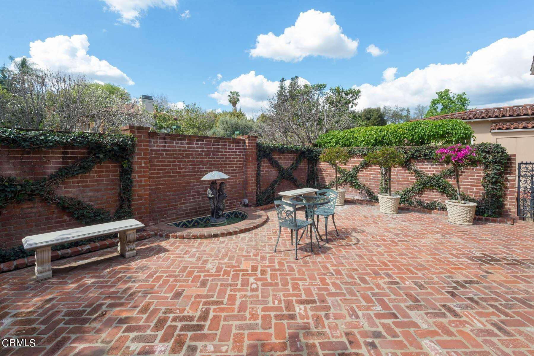 1585 Orlando Road Pasadena, CA 91106 - Photo 36 of 47 a view of a patio with a table and chairs