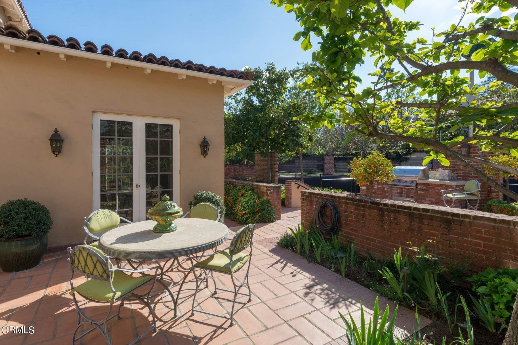 1585 Orlando Road Pasadena, CA 91106 - Photo 43 of 47 a view of a patio with table and chairs and potted plants