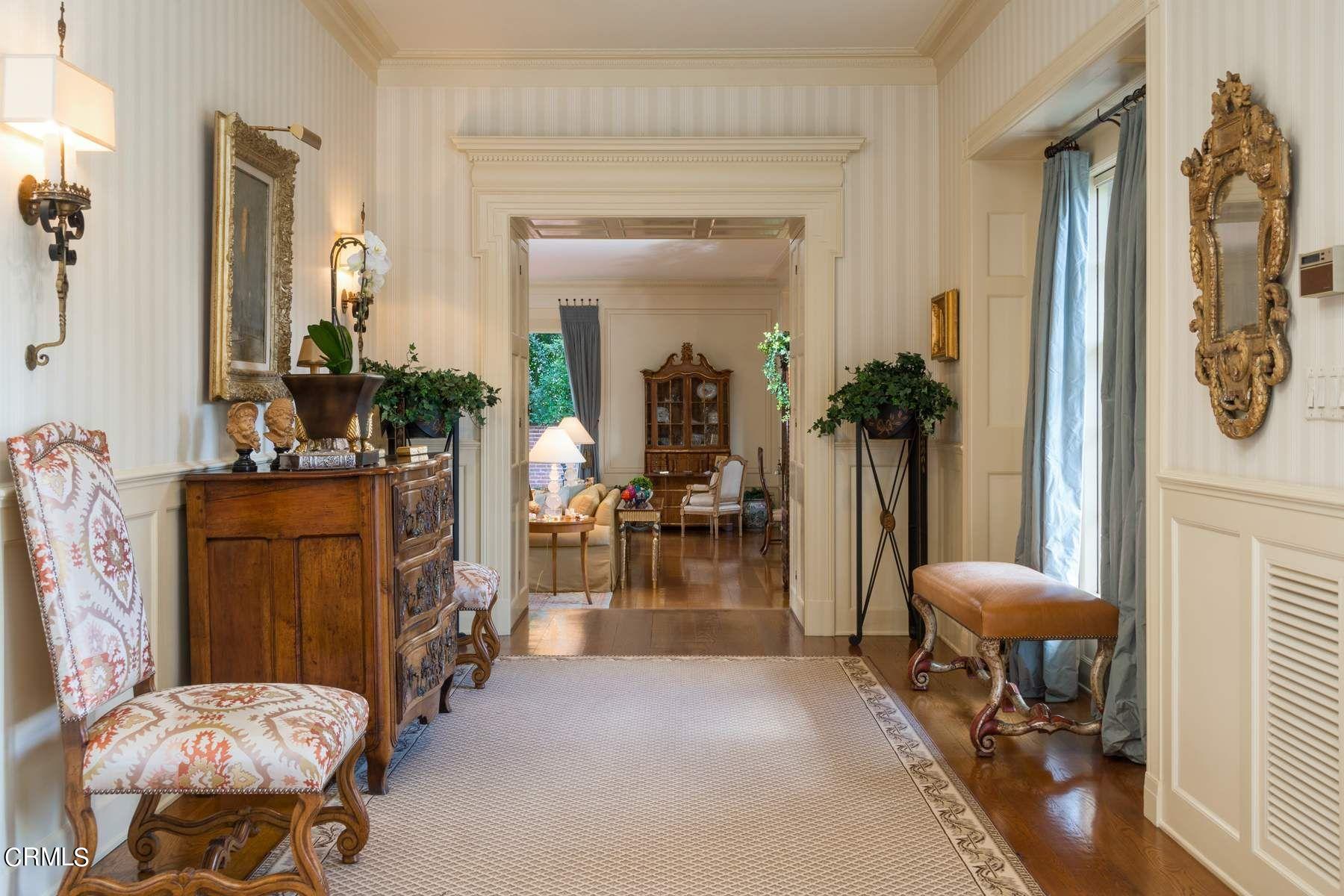 1585 Orlando Road Pasadena, CA 91106 - Photo 9 of 47 a living room with furniture and a chandelier