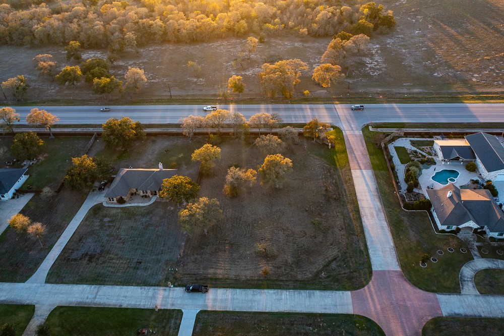 175 Cassena Ranch Drive Bastrop, TX 78602 - Photo 9 of 12 an aerial view of a house with a yard