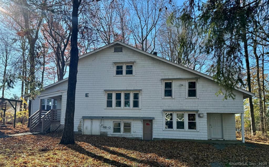 39 Waterbury Road, Unit E3 Prospect, CT 06712 - Photo 1 of 17 a front view of a house with garden