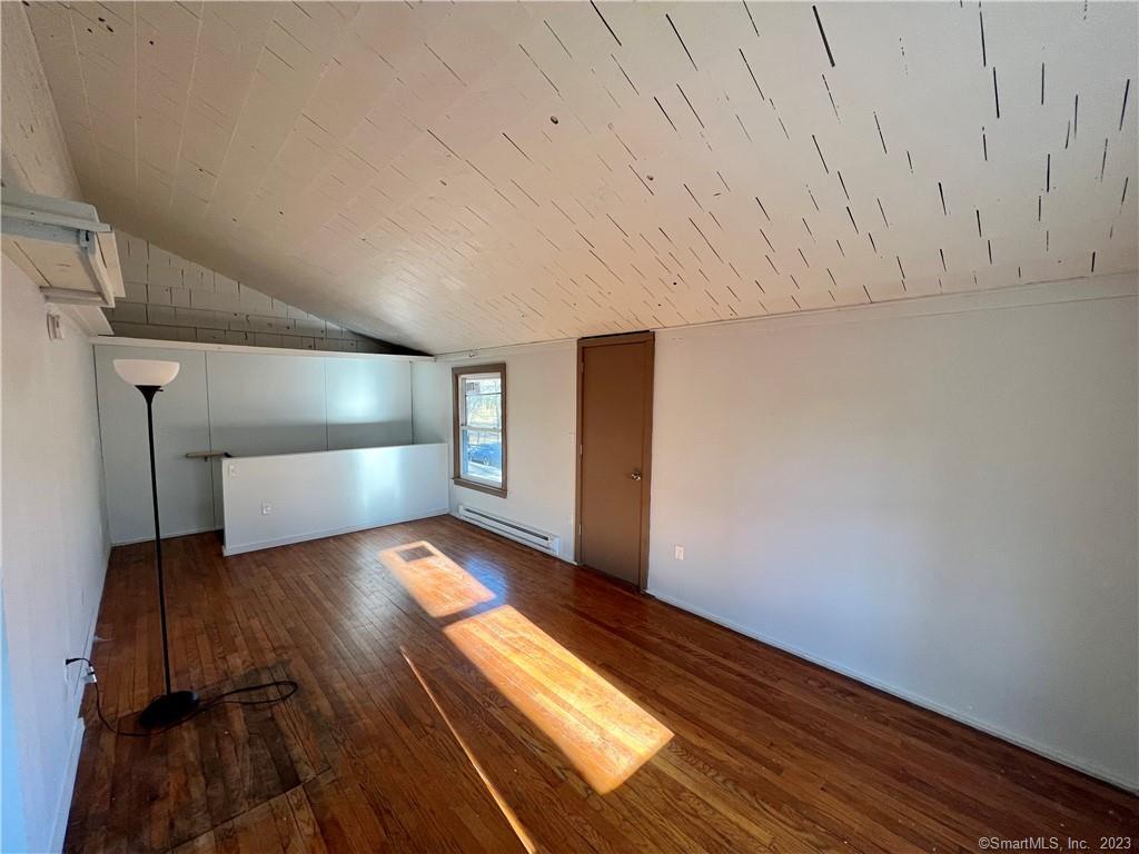 39 Waterbury Road, Unit E3 Prospect, CT 06712 - Photo 3 of 17 a view of wooden floor in an empty room