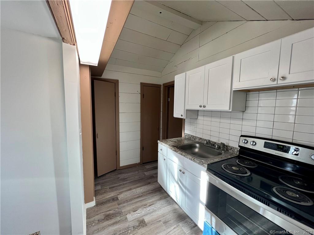 39 Waterbury Road, Unit E3 Prospect, CT 06712 - Photo 5 of 17 a kitchen with sink and cabinets