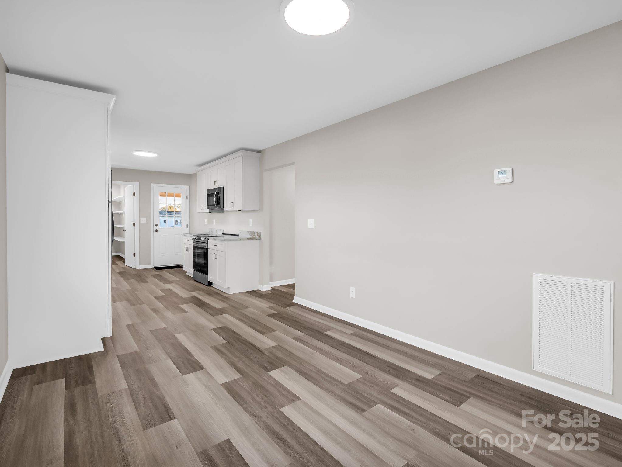 1696 Race Path Church Road Mooresboro, NC 28114 - Photo 12 of 31 a view of kitchen and empty room