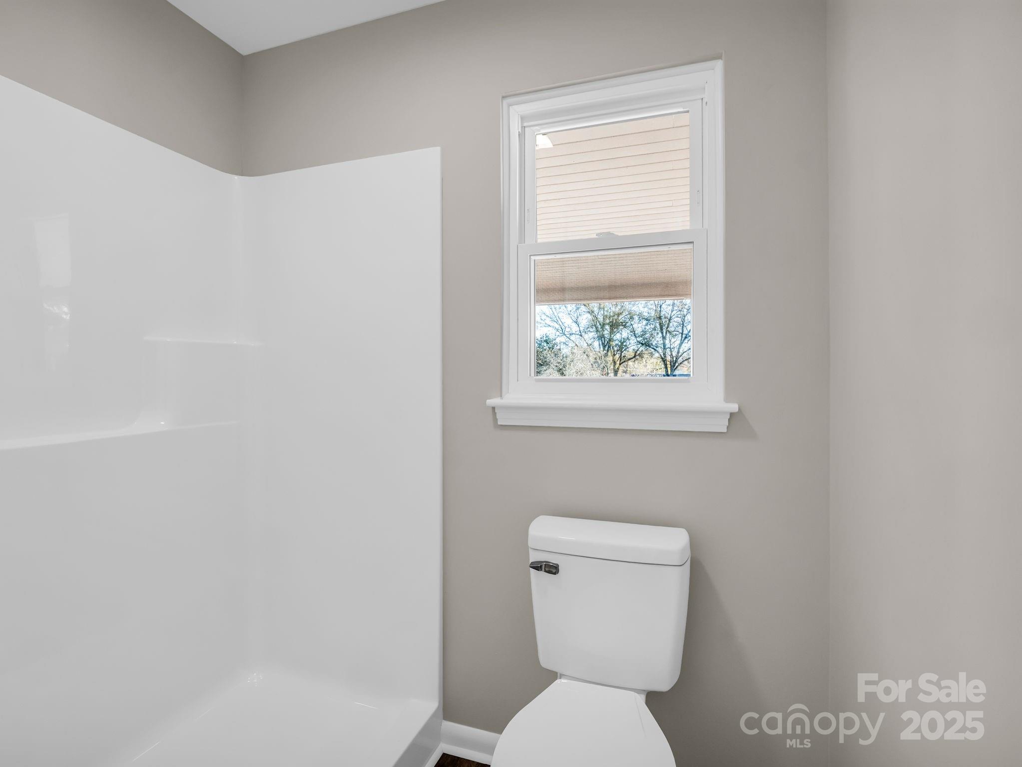 1696 Race Path Church Road Mooresboro, NC 28114 - Photo 19 of 31 a white toilet sitting next to a window