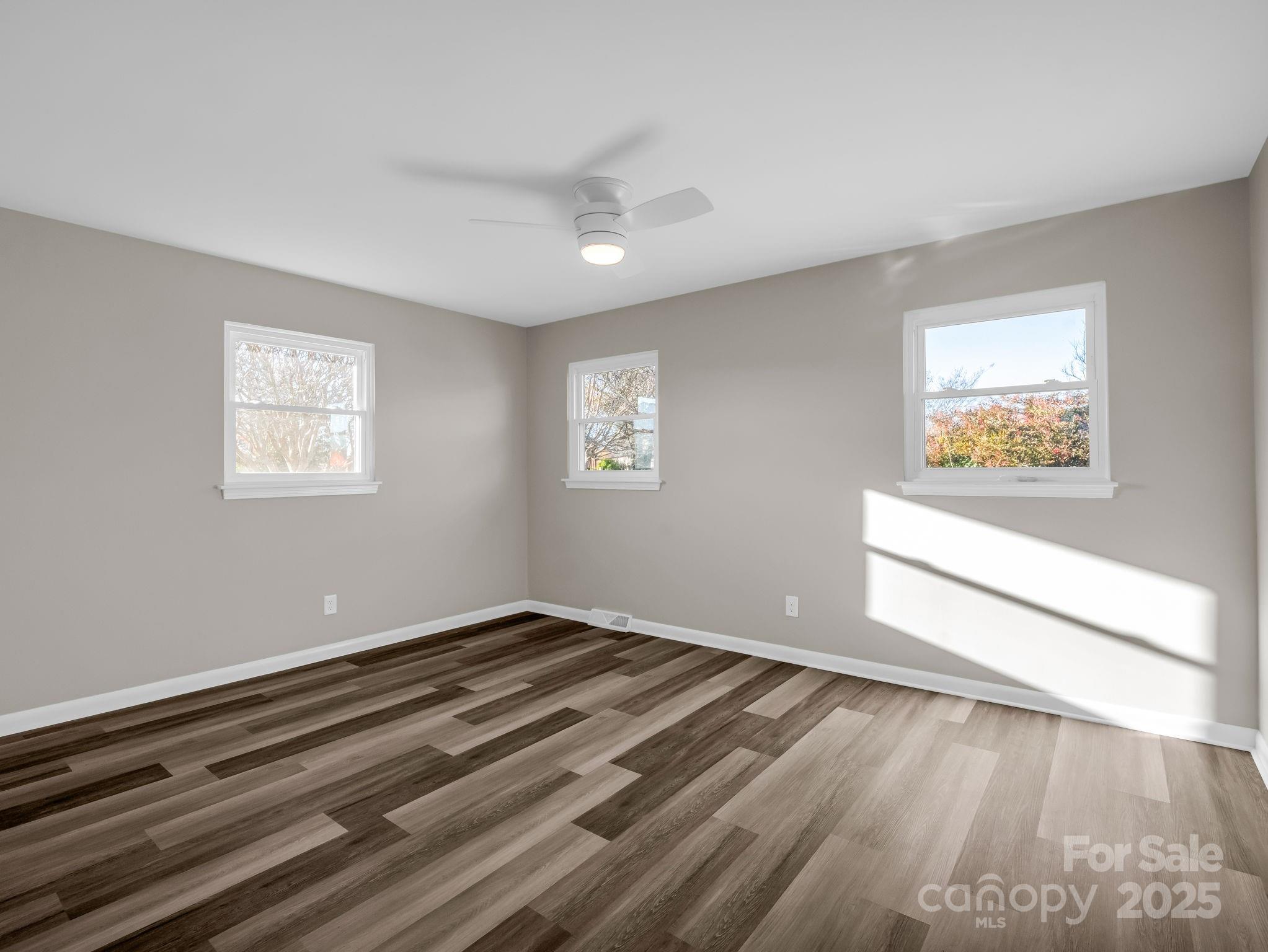 1696 Race Path Church Road Mooresboro, NC 28114 - Photo 20 of 31 a view of an empty room with wooden floor and a window
