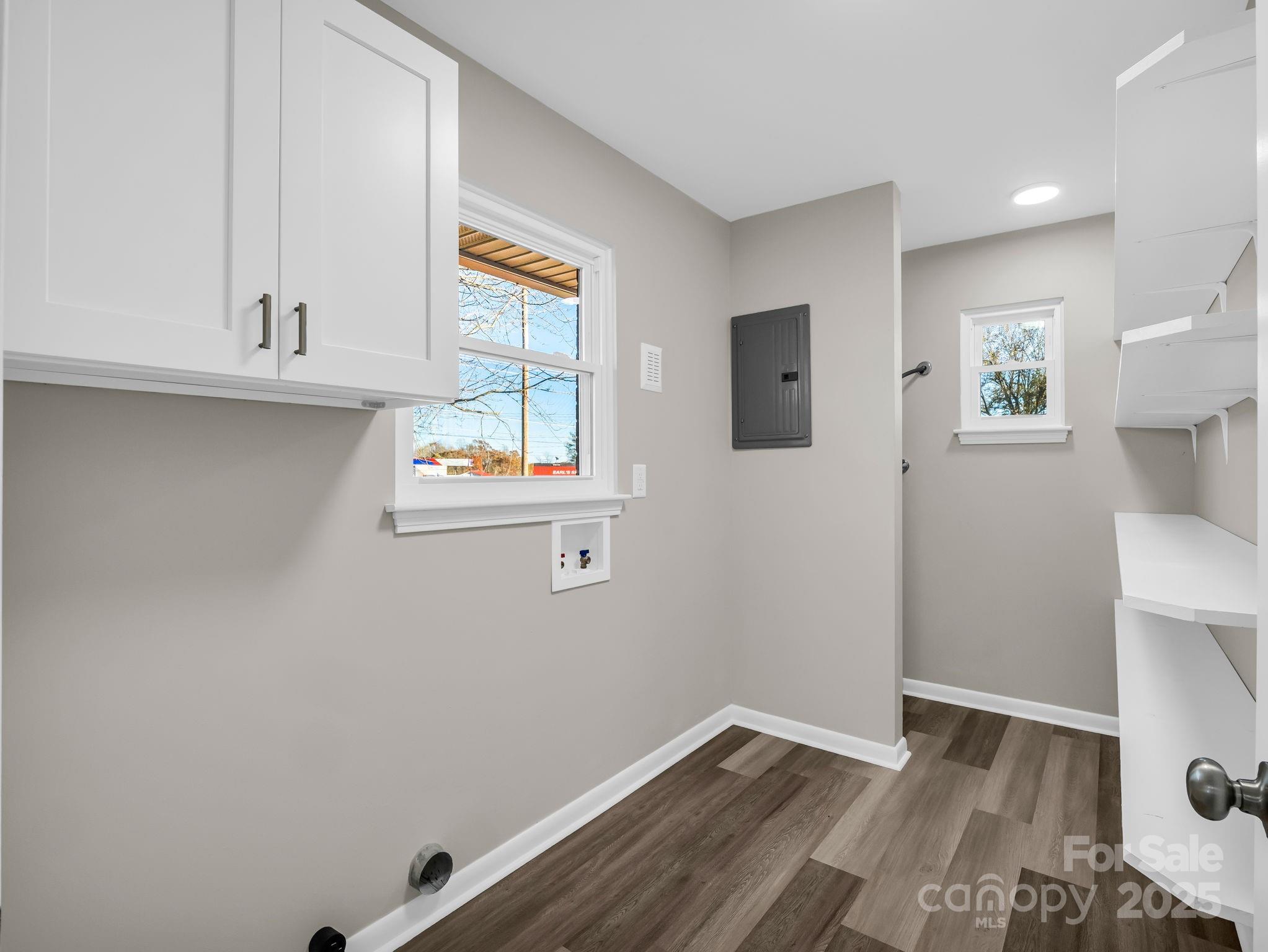 1696 Race Path Church Road Mooresboro, NC 28114 - Photo 24 of 31 an empty room with wooden floor and windows