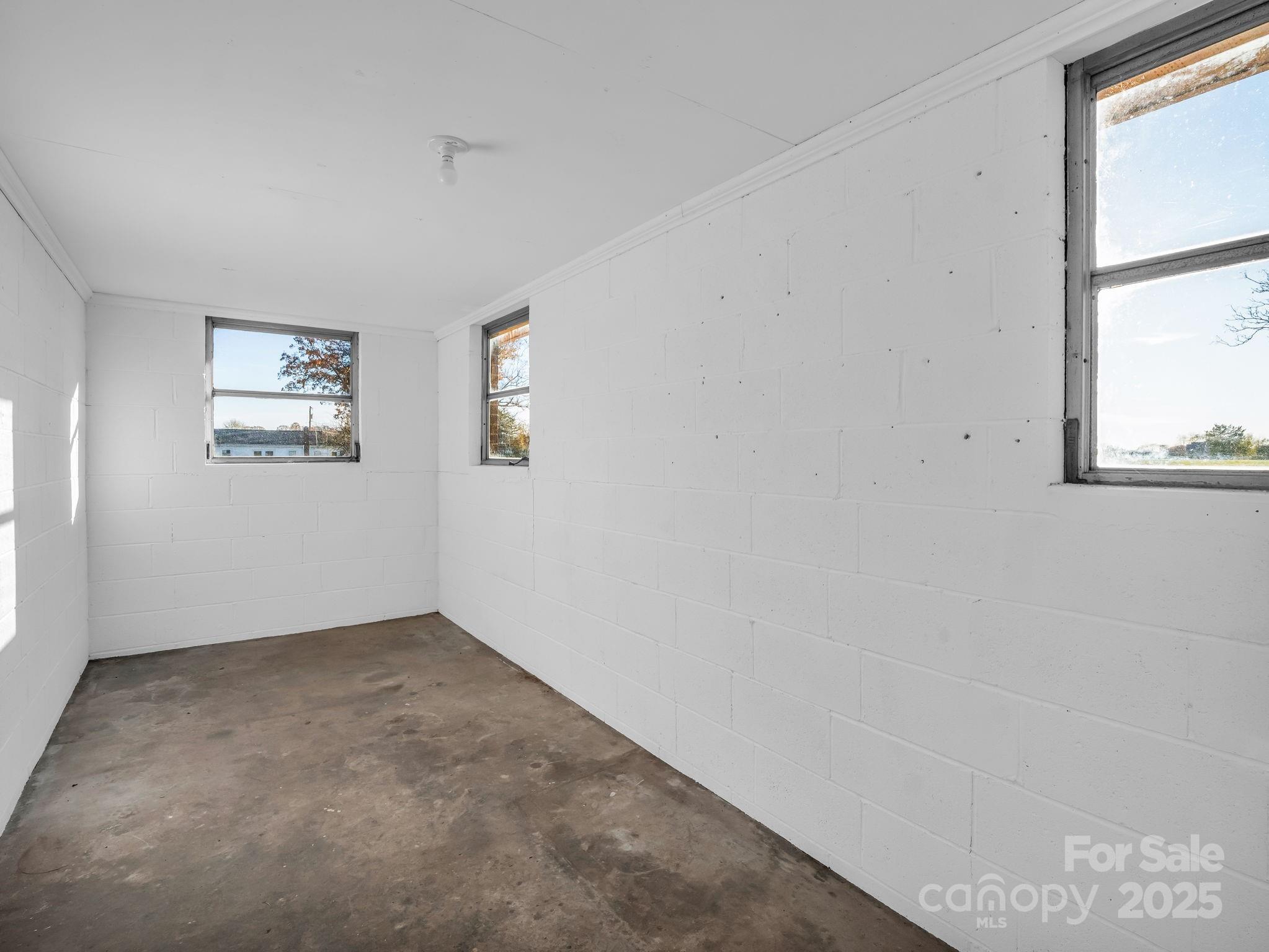 1696 Race Path Church Road Mooresboro, NC 28114 - Photo 25 of 31 an empty room with windows