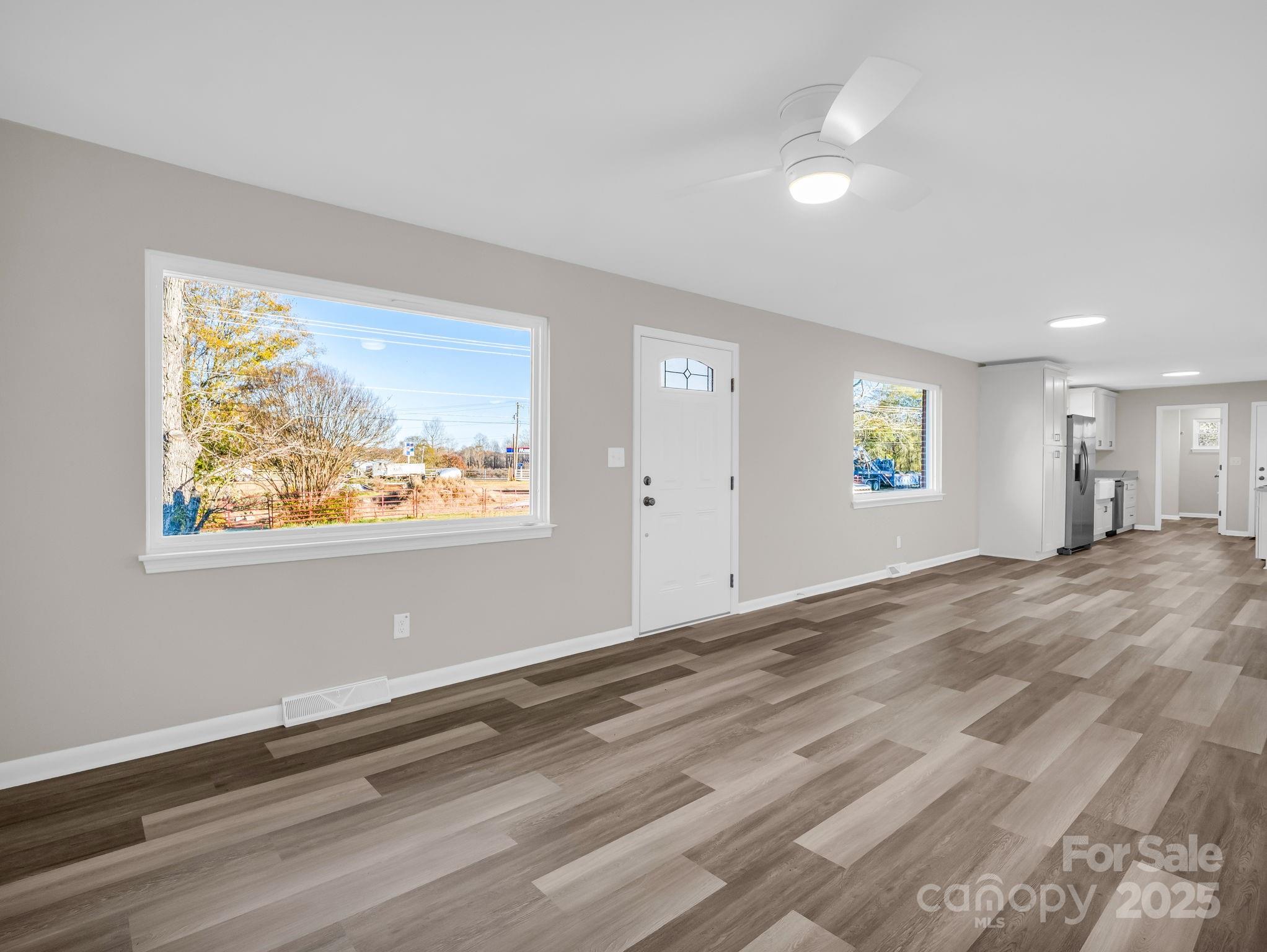 1696 Race Path Church Road Mooresboro, NC 28114 - Photo 6 of 31 a view of empty room with window and wooden floor
