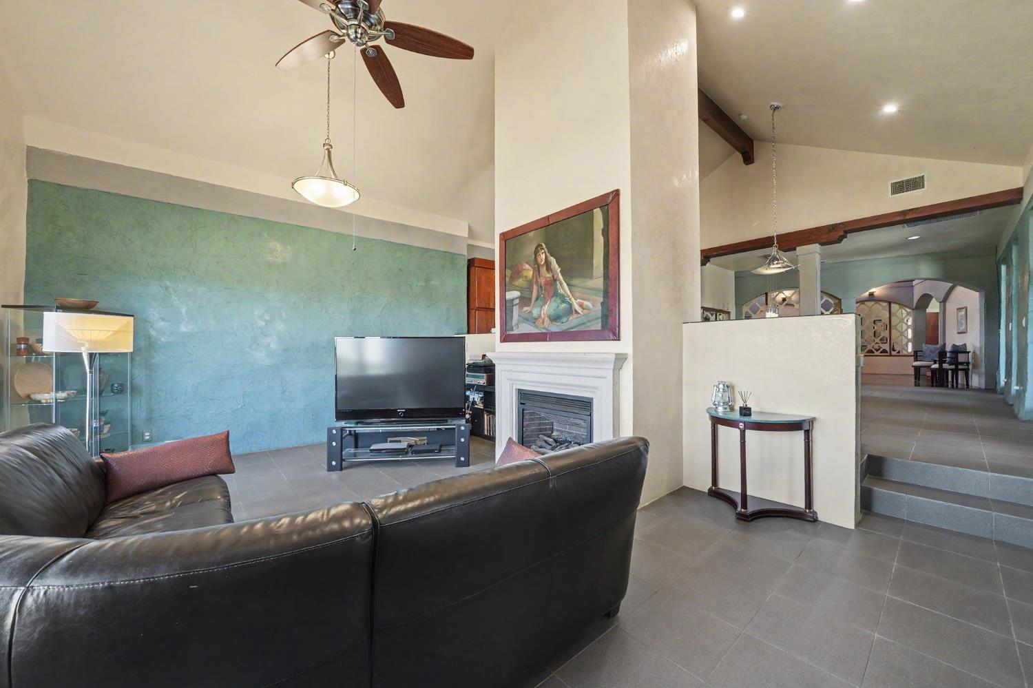 15070 Willow Creek Road Ione, CA 95640 - Photo 37 of 66 a living room with furniture and a flat screen tv