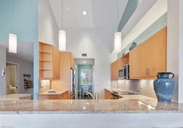 a room with furniture and a large window