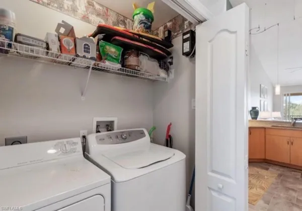 a kitchen with a table and chairs in it
