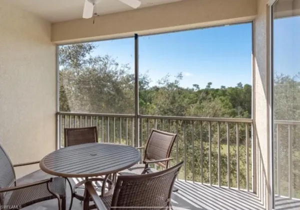 a view of a balcony with furniture