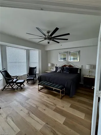 a bed room with furniture and a window