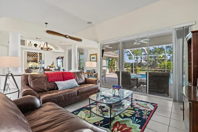 a view of a dining room with furniture and chandelier