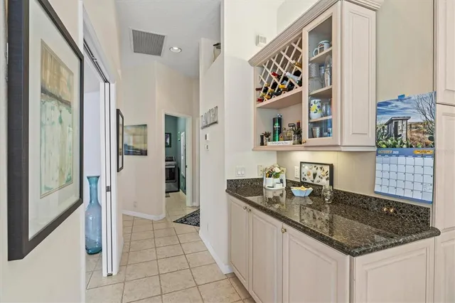 a kitchen with a sink a stove and a microwave