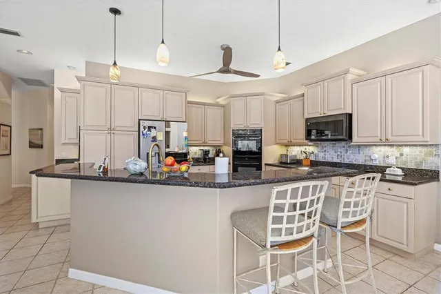 a view of a dining room with furniture and a window