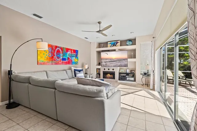 a bathroom with a granite countertop sink a toilet a mirror a vanity and shower