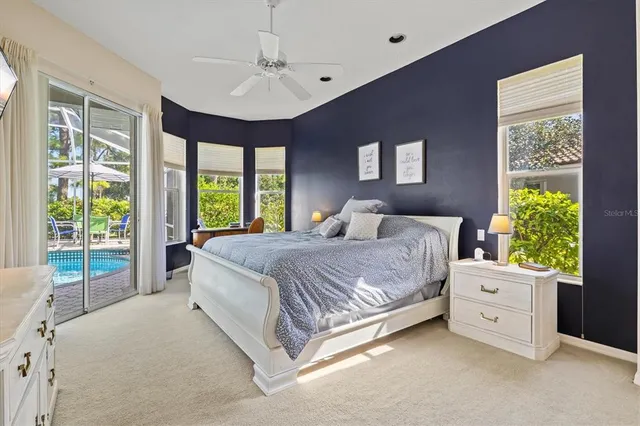 a lobby with furniture and floor to ceiling window