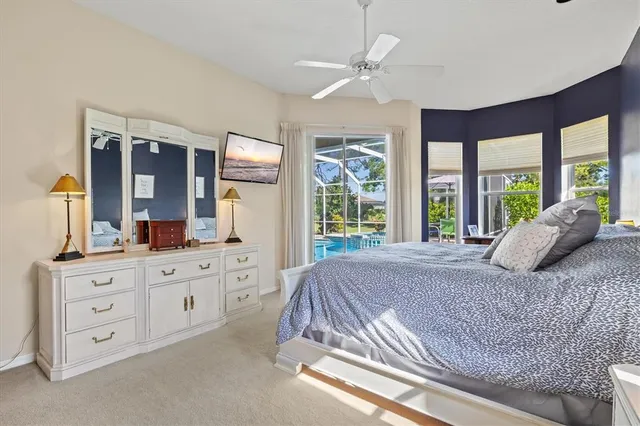a view of a swimming pool with sitting area