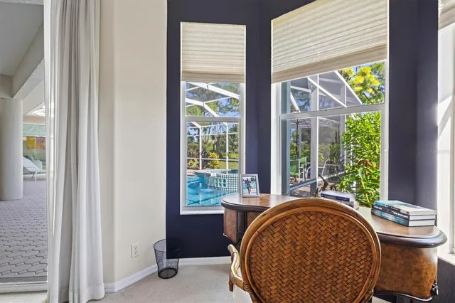 a view of a swimming pool with sitting area