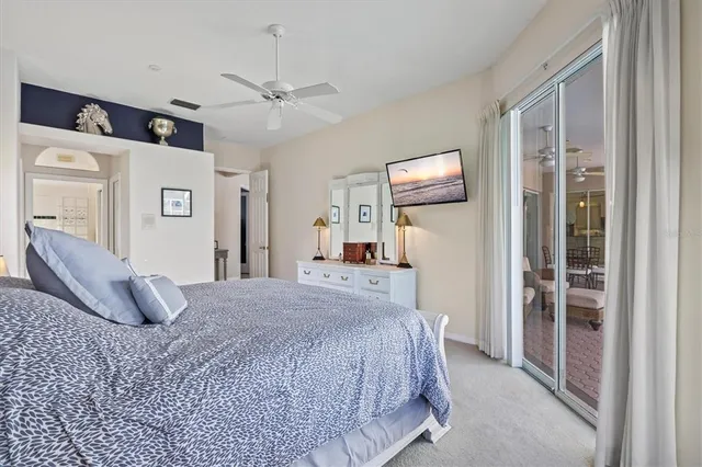 a view of a patio with a table and chairs under an umbrella