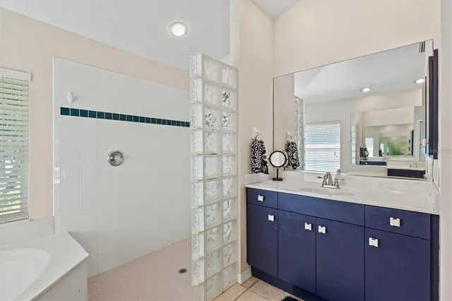 a front view of a house with swimming pool having outdoor seating