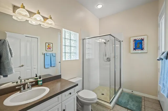 an aerial view of a house with swimming pool and garden