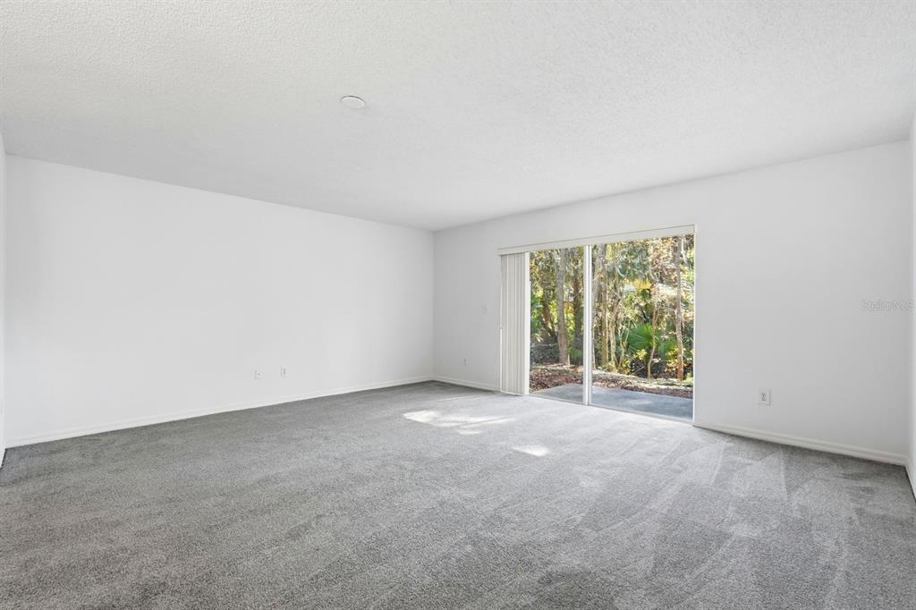 1502 Deer Springs Road Port Orange, FL 32129 - Photo 13 of 35 an empty room with large windows