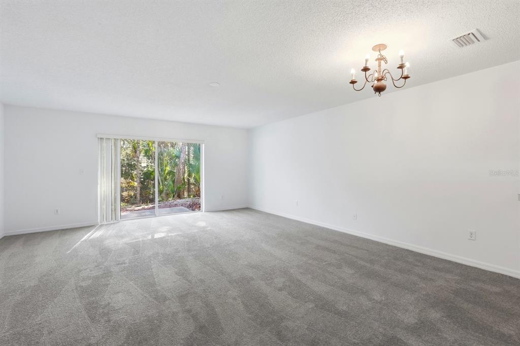1502 Deer Springs Road Port Orange, FL 32129 - Photo 14 of 35 a view of a chandelier and a chandelier in big room