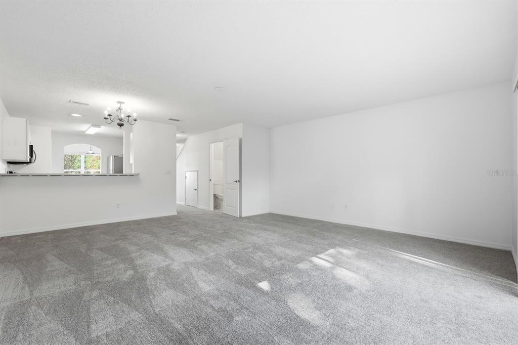 1502 Deer Springs Road Port Orange, FL 32129 - Photo 15 of 35 a view of an empty room with a kitchen