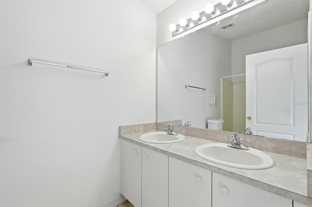 1502 Deer Springs Road Port Orange, FL 32129 - Photo 19 of 35 a bathroom with a sink and a mirror