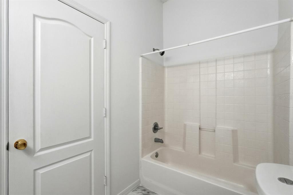 1502 Deer Springs Road Port Orange, FL 32129 - Photo 20 of 35 a bathroom with a bathtub
