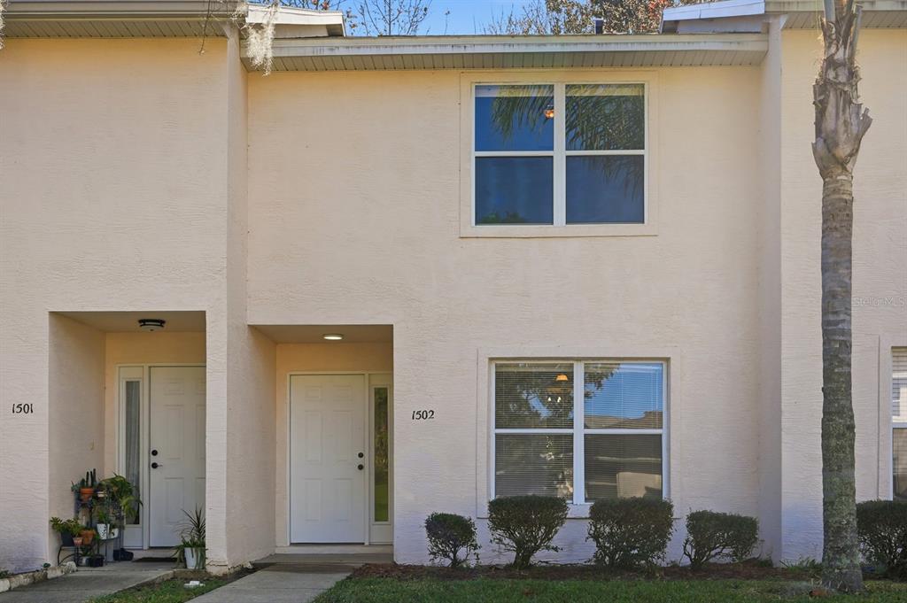 1502 Deer Springs Road Port Orange, FL 32129 - Photo 2 of 35 a front view of a house with a yard