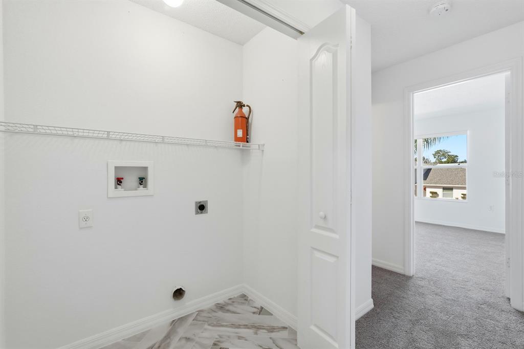 1502 Deer Springs Road Port Orange, FL 32129 - Photo 22 of 35 a view of hallway with baby crib