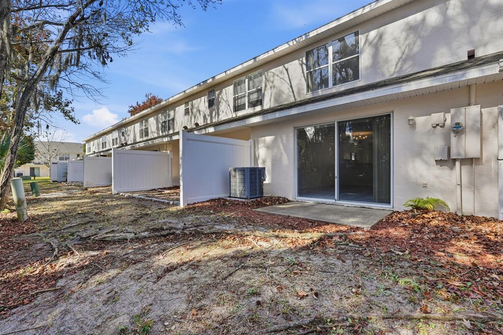 1502 Deer Springs Road Port Orange, FL 32129 - Photo 26 of 35 a view of a house with a backyard